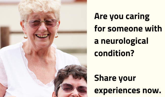 Image of two ladies.One in a wheelchair the other is behind. They are both smiling.