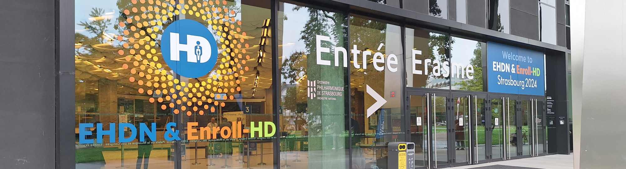 Outside of a building showing signage for the EHDN conference
